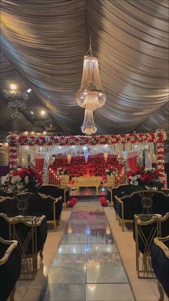 Film of chandeliers glowing over the dressed hall