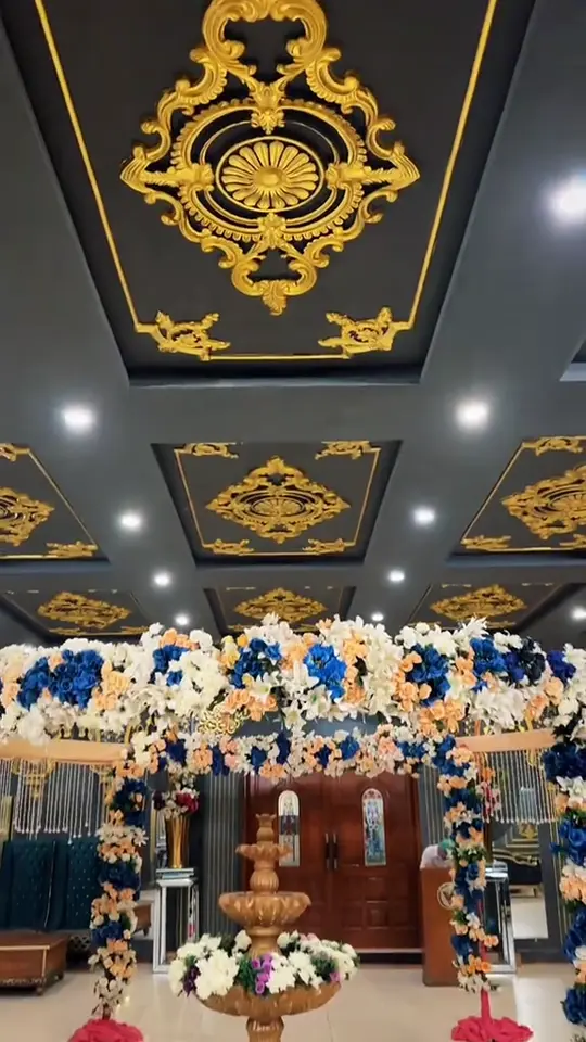 Film of a pastel engagement archway and ring-ceremony setting
