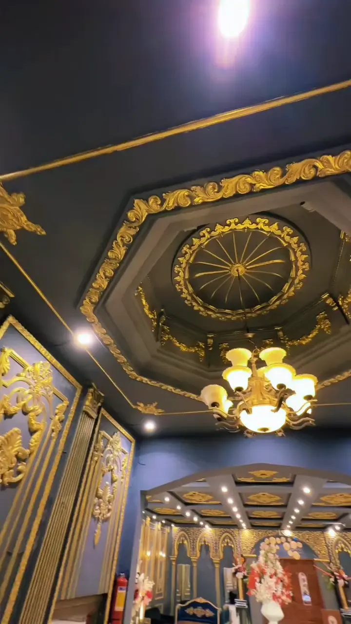 Victoria Grand Marquee — gold-panelled entrance and chandelier hall by night