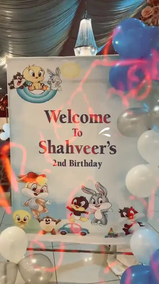 Film of a themed birthday setup with balloon installation